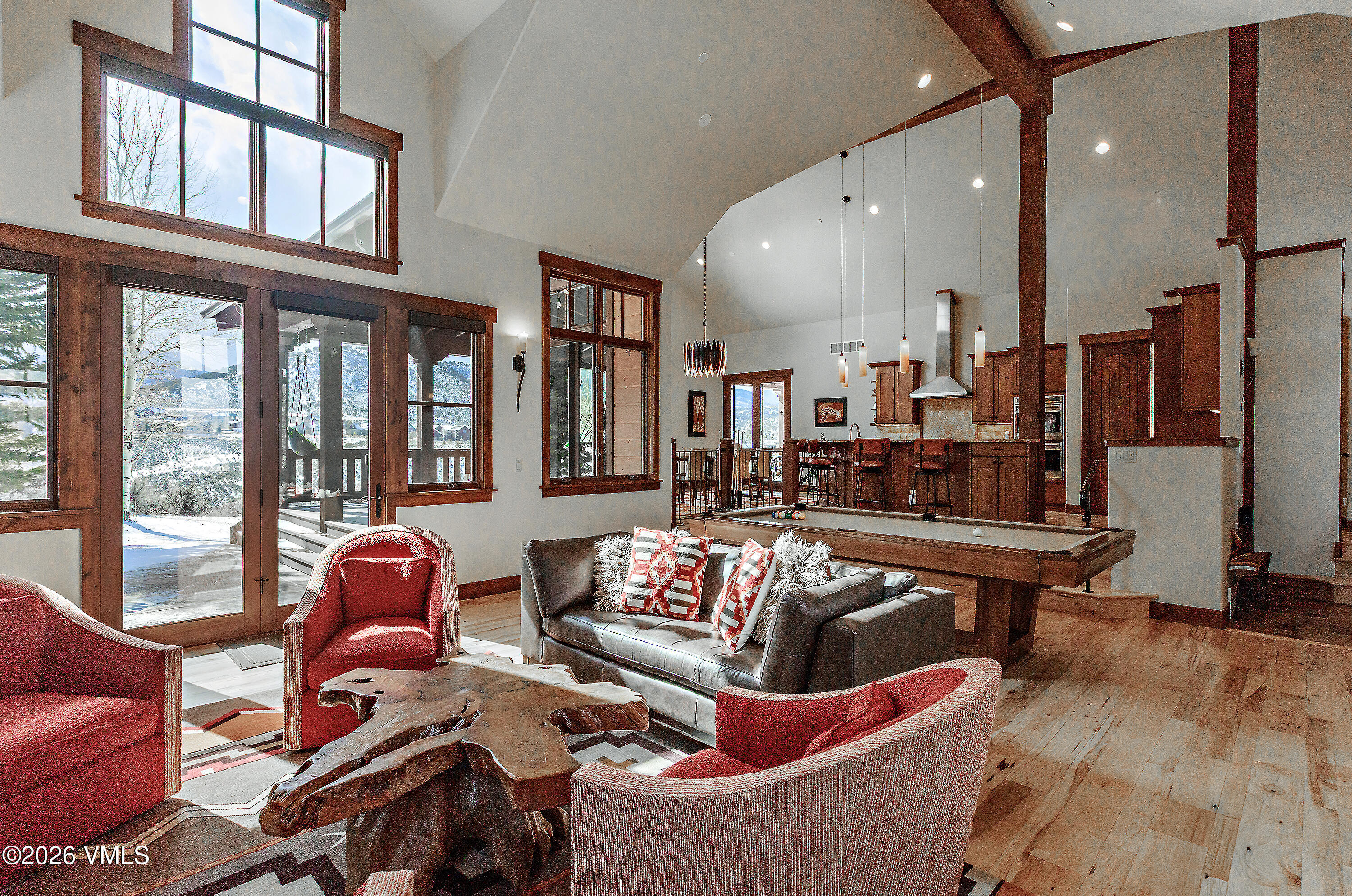 2753 East Haystacker Drive Eagle, CO 81631 - Photo 10 of 41 a living room with furniture kitchen view and large windows
