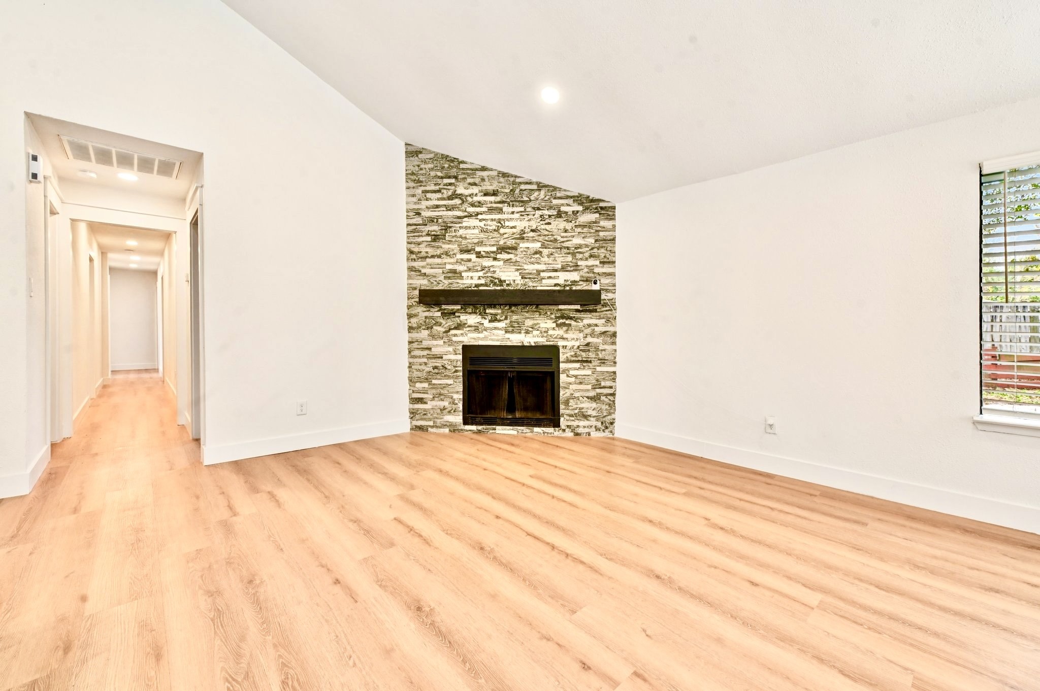 17307 Eden Court Spring, TX 77379 - Photo 11 of 43 a view of an empty room with wooden floor and a window