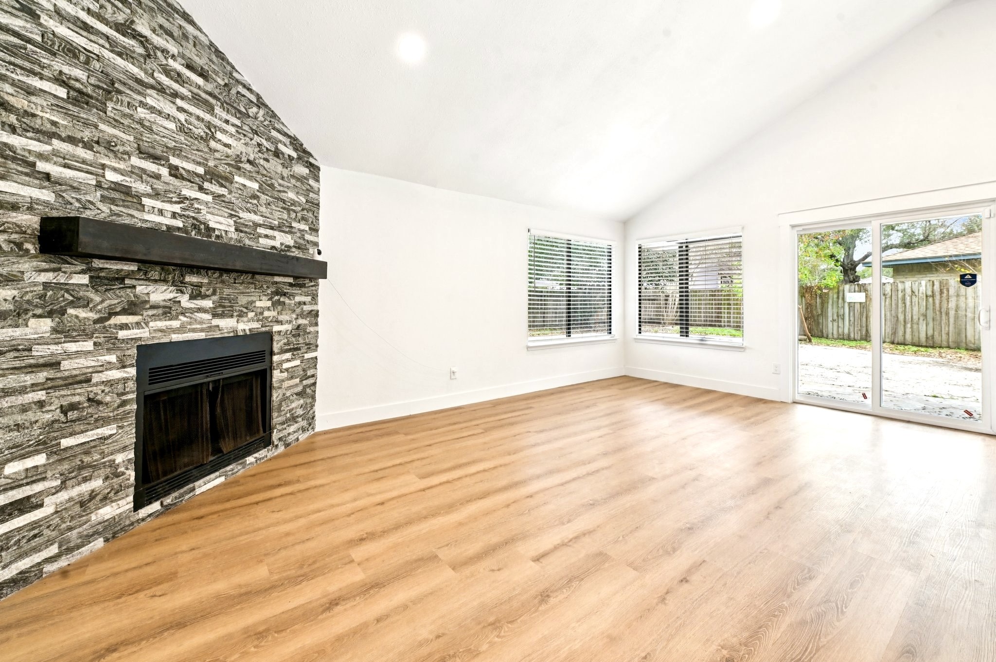 17307 Eden Court Spring, TX 77379 - Photo 12 of 43 a view of an empty room with a fireplace
