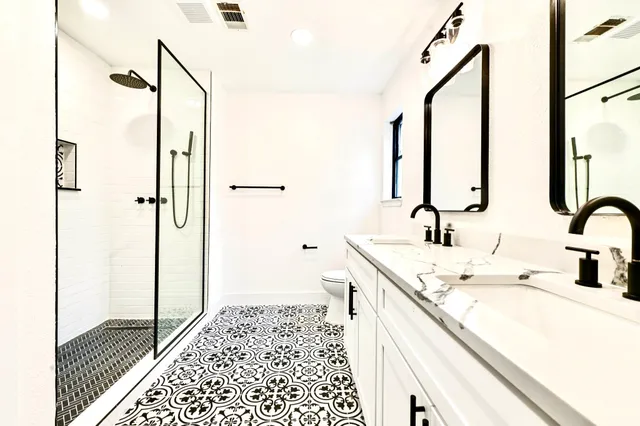 a picture of a bathroom with a shower