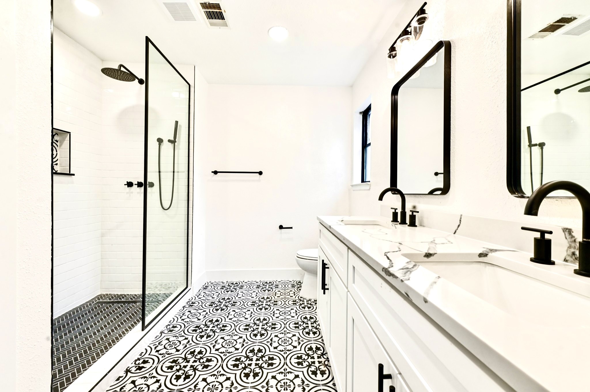 17307 Eden Court Spring, TX 77379 - Photo 24 of 43 a bathroom with a double vanity sink and a mirror