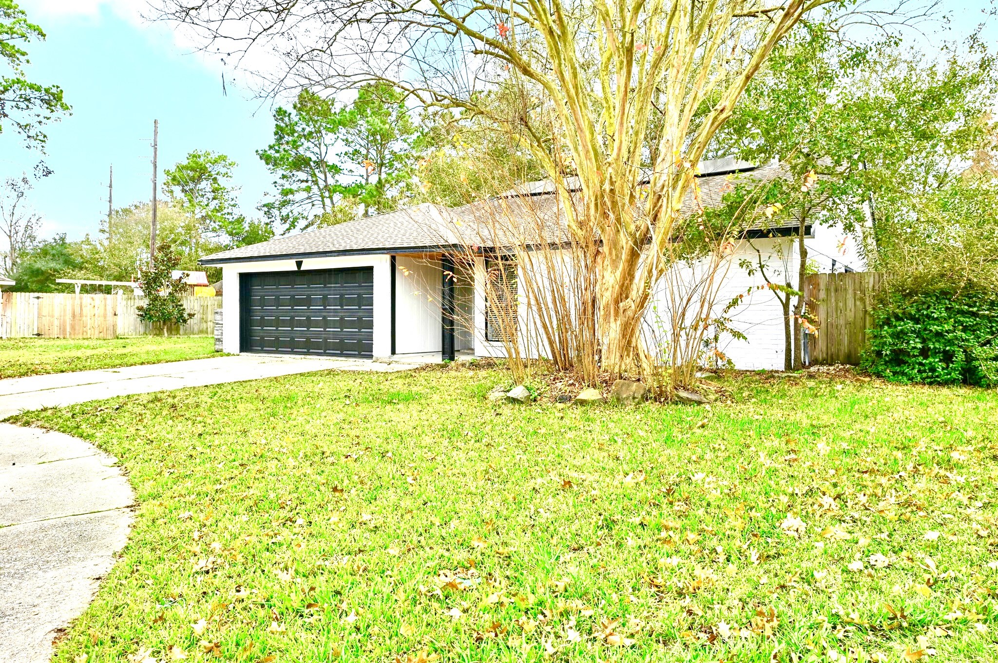 17307 Eden Court Spring, TX 77379 - Photo 3 of 43 a view of yellow house with a yard
