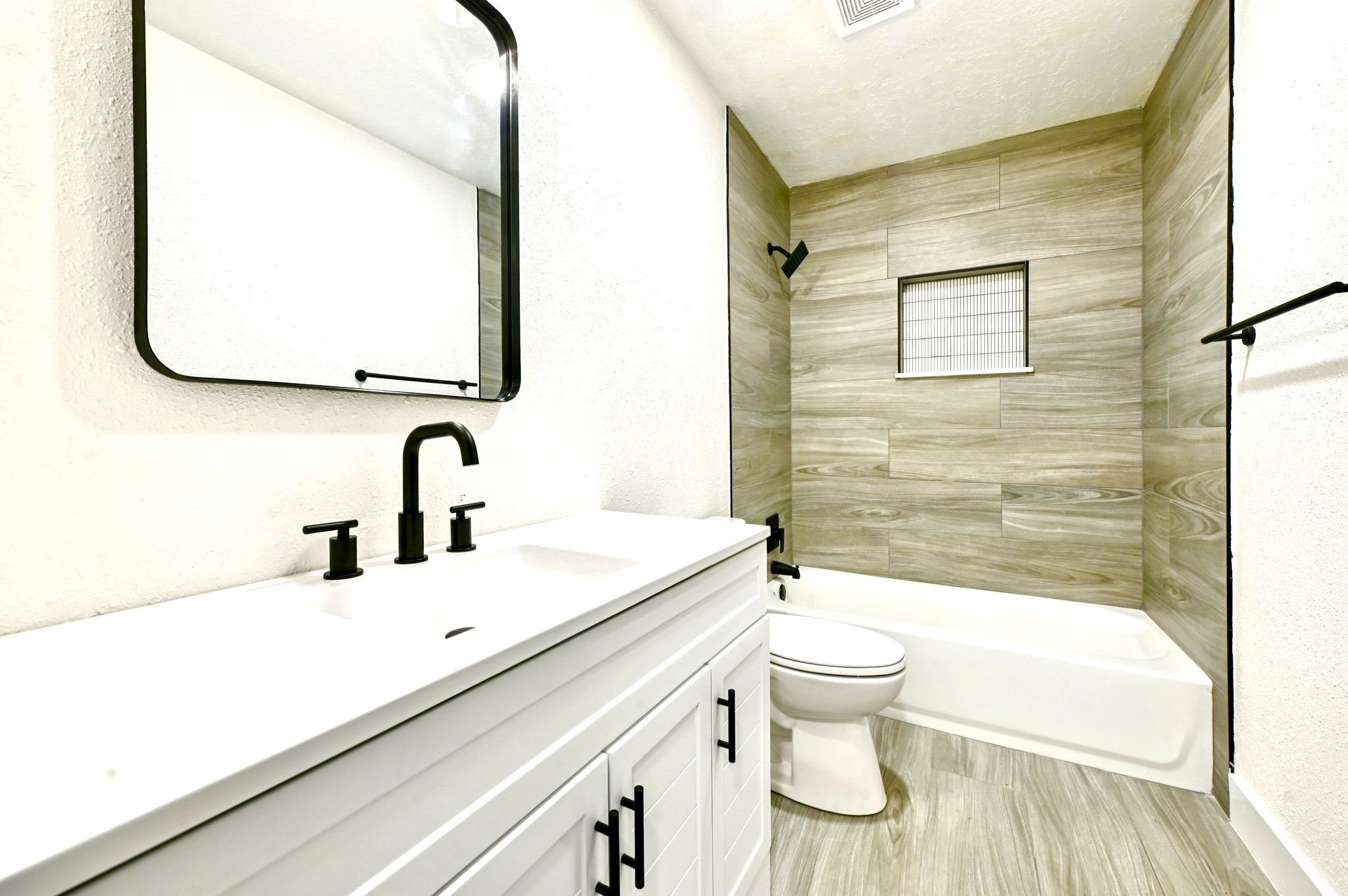 17307 Eden Court Spring, TX 77379 - Photo 31 of 43 a bathroom with a sink a toilet and a mirror