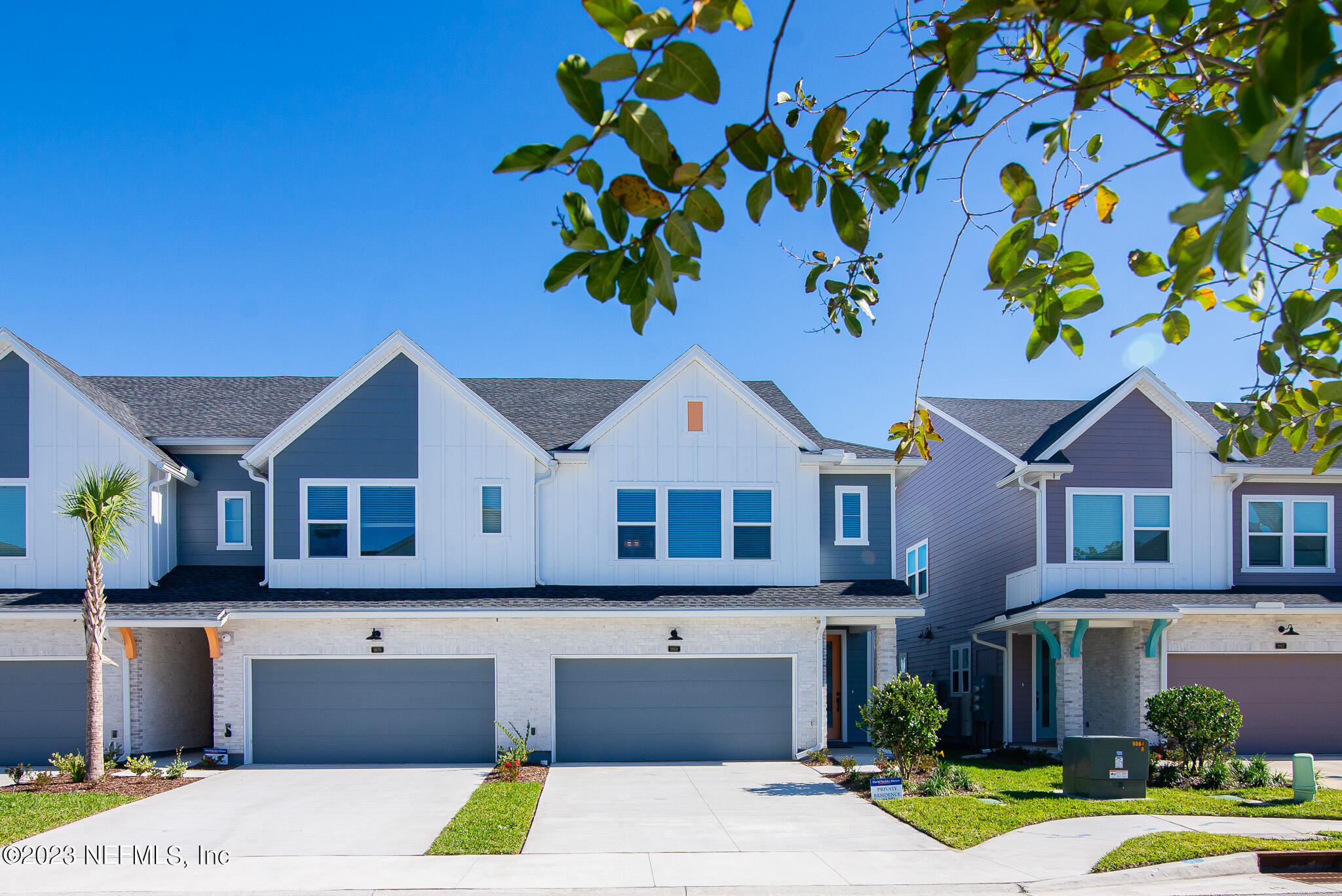 9868 Element Road Jacksonville, FL 32256 - Photo 1 of 36 a front view of a house with a garden and yard