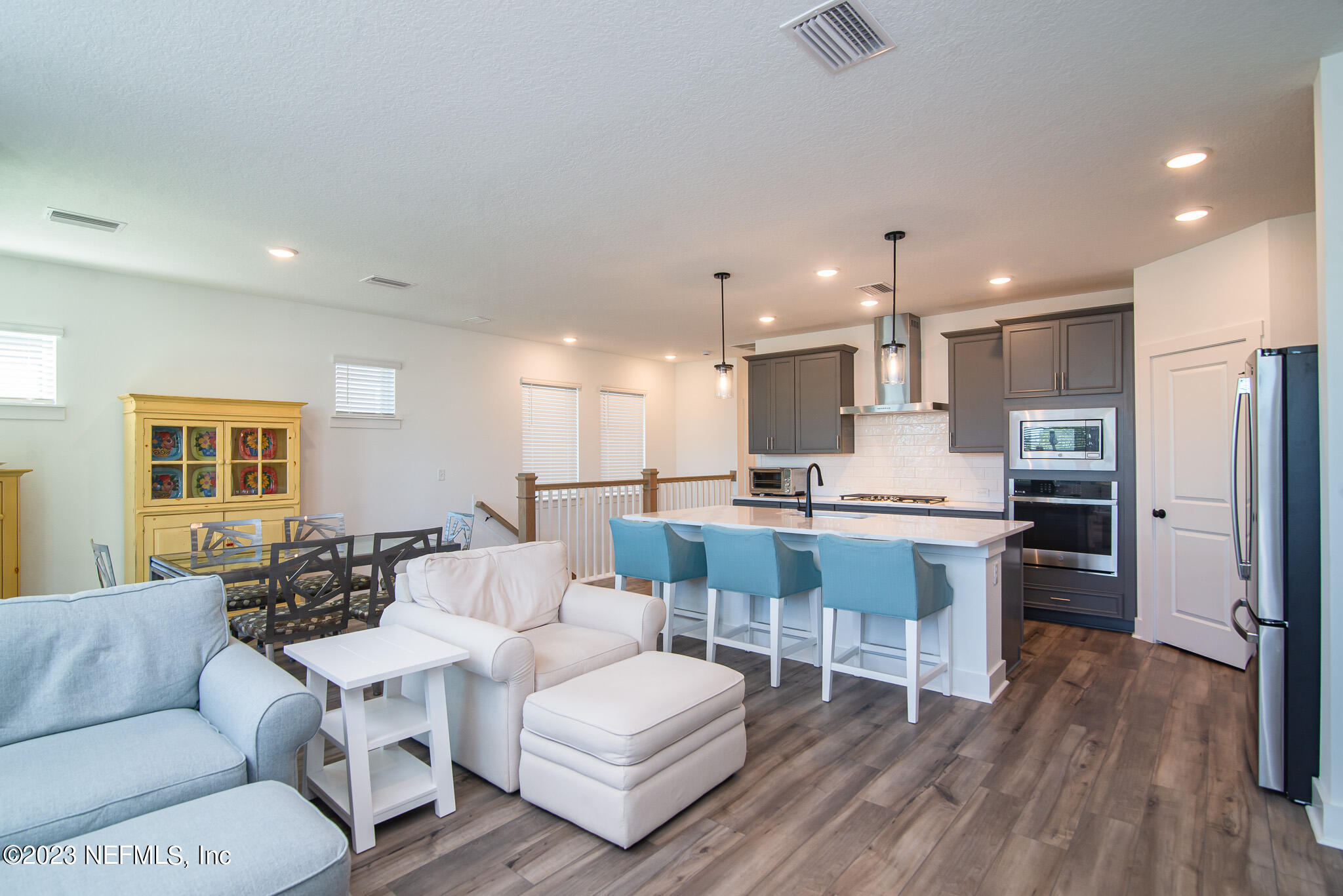 9868 Element Road Jacksonville, FL 32256 - Photo 13 of 36 a living room with furniture and kitchen view