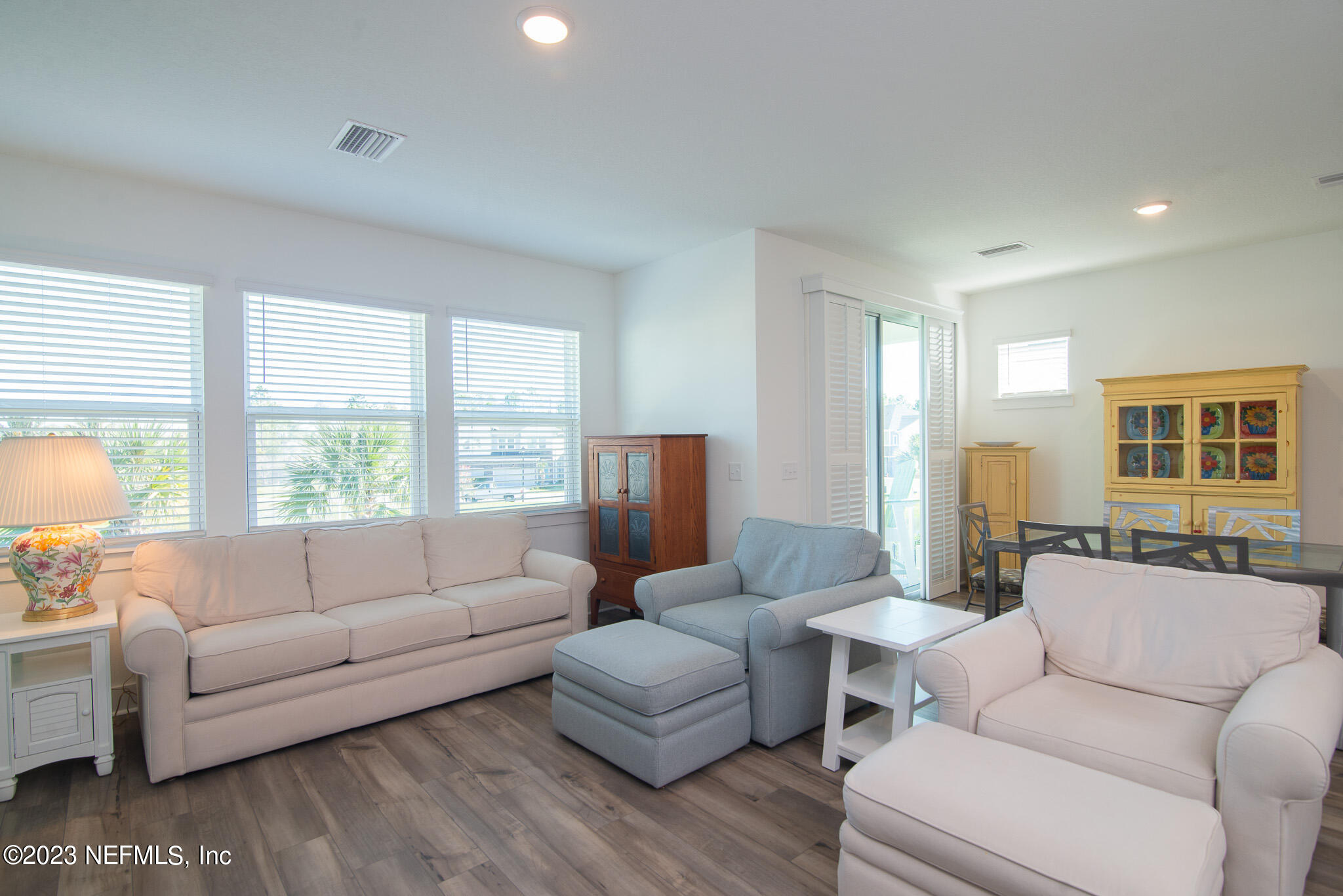 9868 Element Road Jacksonville, FL 32256 - Photo 14 of 36 a living room with furniture and a large window