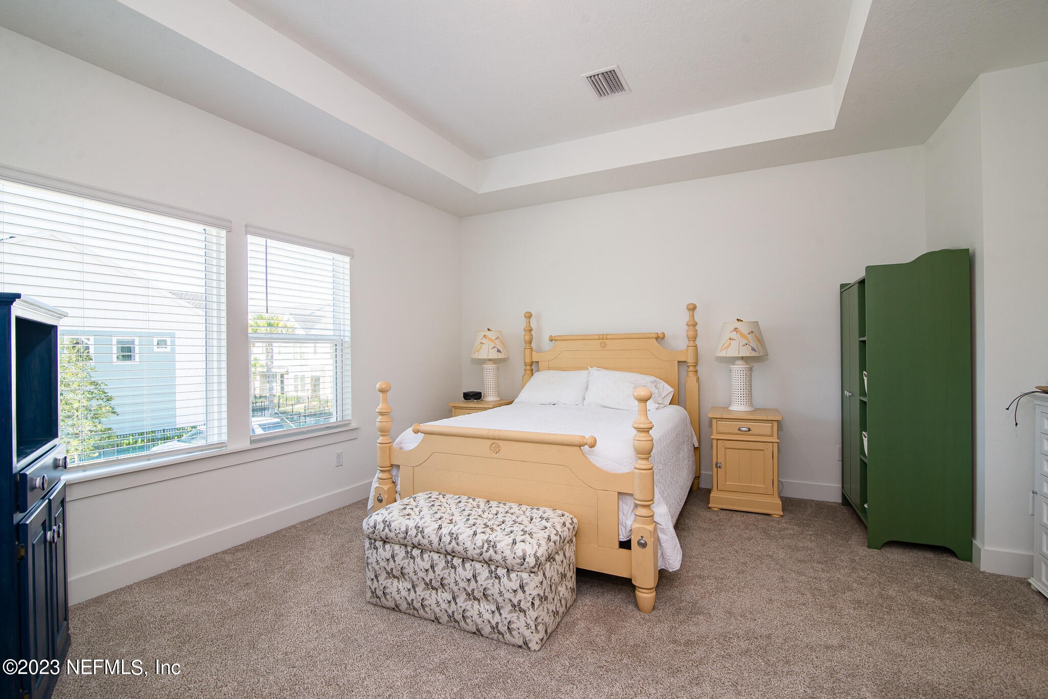 9868 Element Road Jacksonville, FL 32256 - Photo 16 of 36 a bedroom with a bed and a window