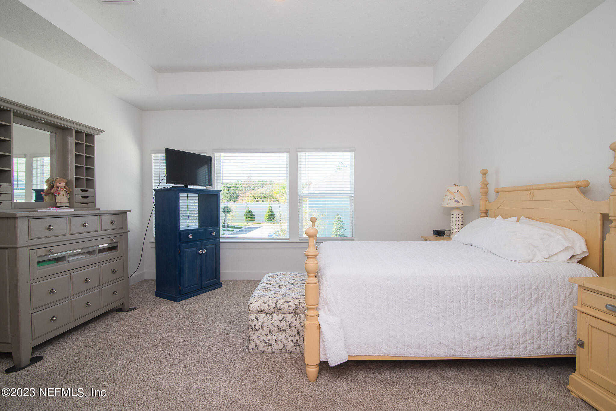 9868 Element Road Jacksonville, FL 32256 - Photo 17 of 36 a bedroom with a bed and window