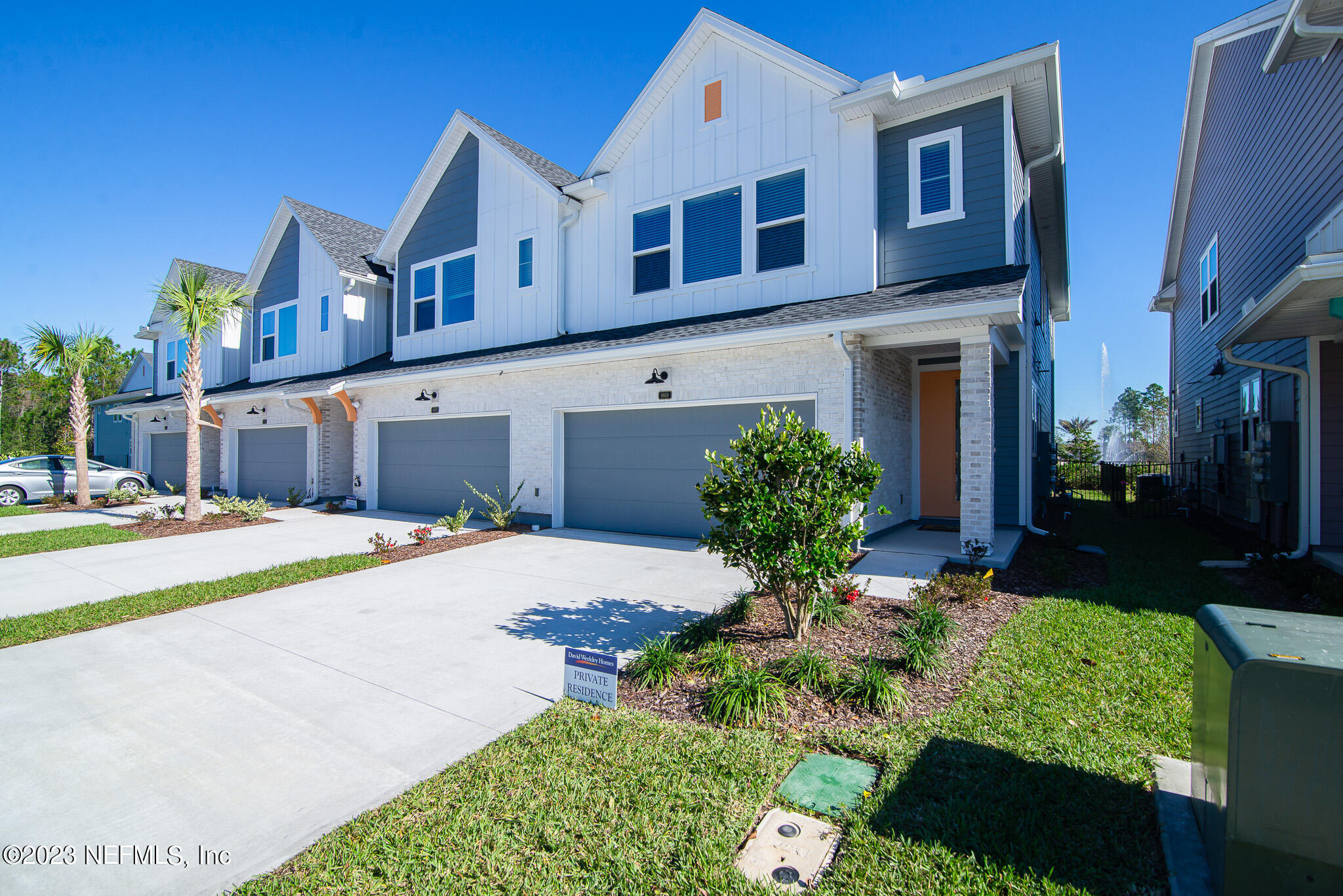 9868 Element Road Jacksonville, FL 32256 - Photo 2 of 36 a front view of a house with a yard
