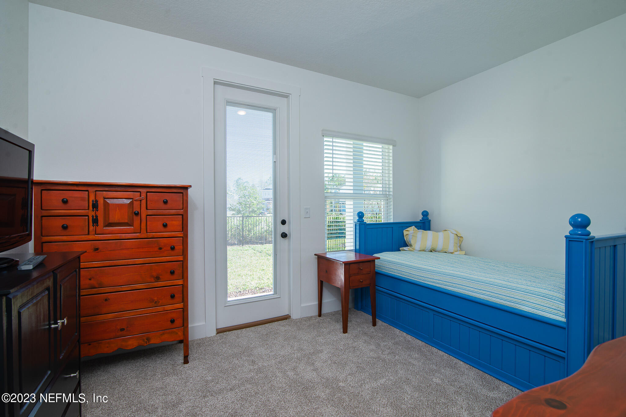 9868 Element Road Jacksonville, FL 32256 - Photo 25 of 36 a bed room with a bed and a window