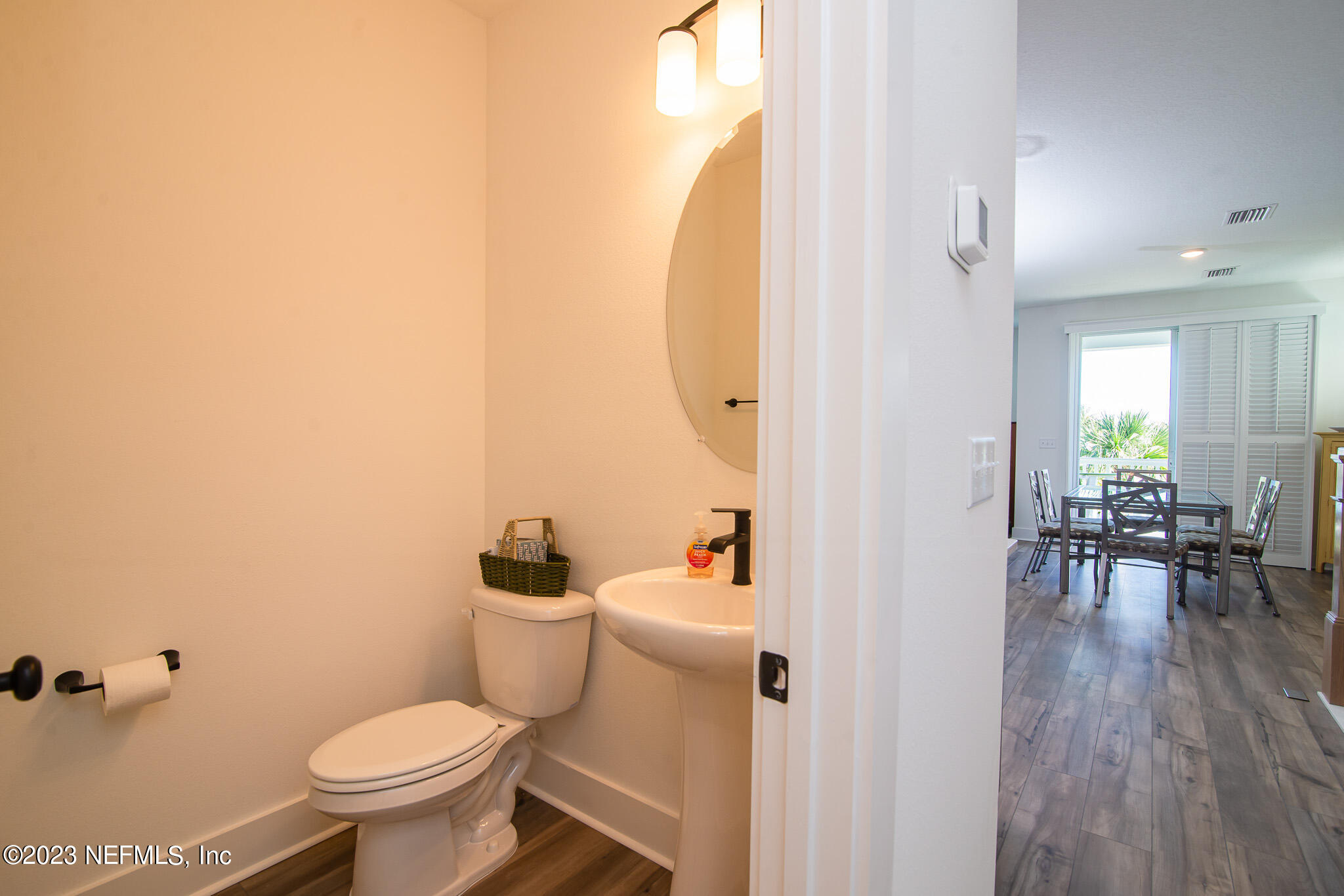 9868 Element Road Jacksonville, FL 32256 - Photo 26 of 36 a bathroom with a toilet and a mirror