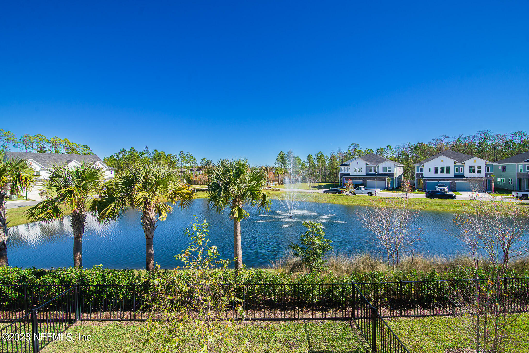 9868 Element Road Jacksonville, FL 32256 - Photo 29 of 36 a view of a lake with a house in the background