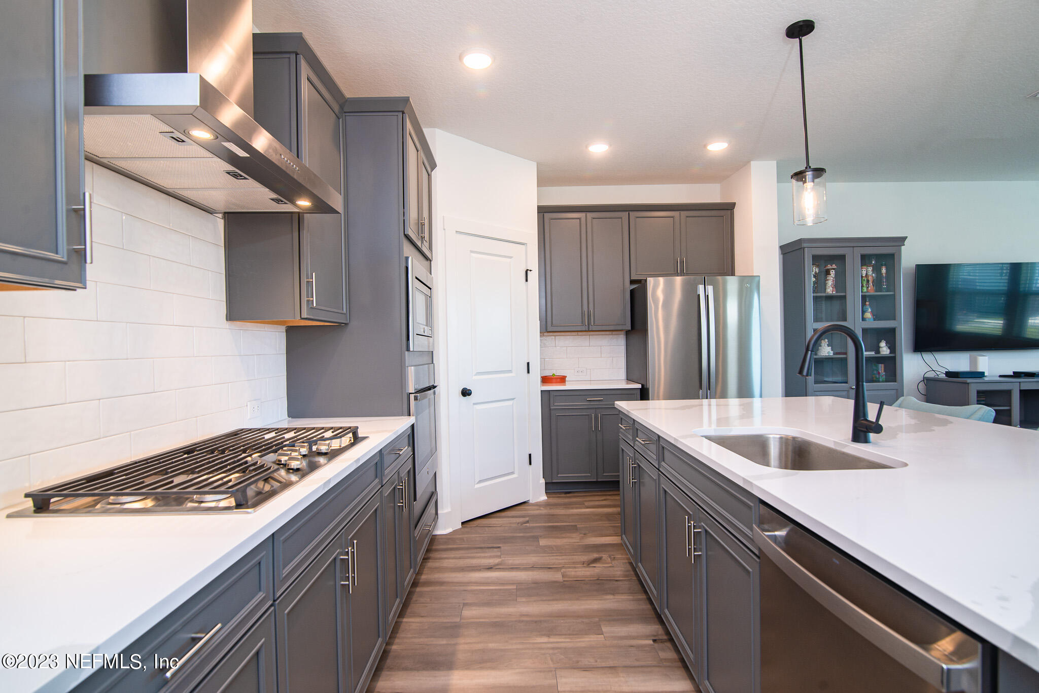 9868 Element Road Jacksonville, FL 32256 - Photo 5 of 36 a kitchen with a sink stove and refrigerator