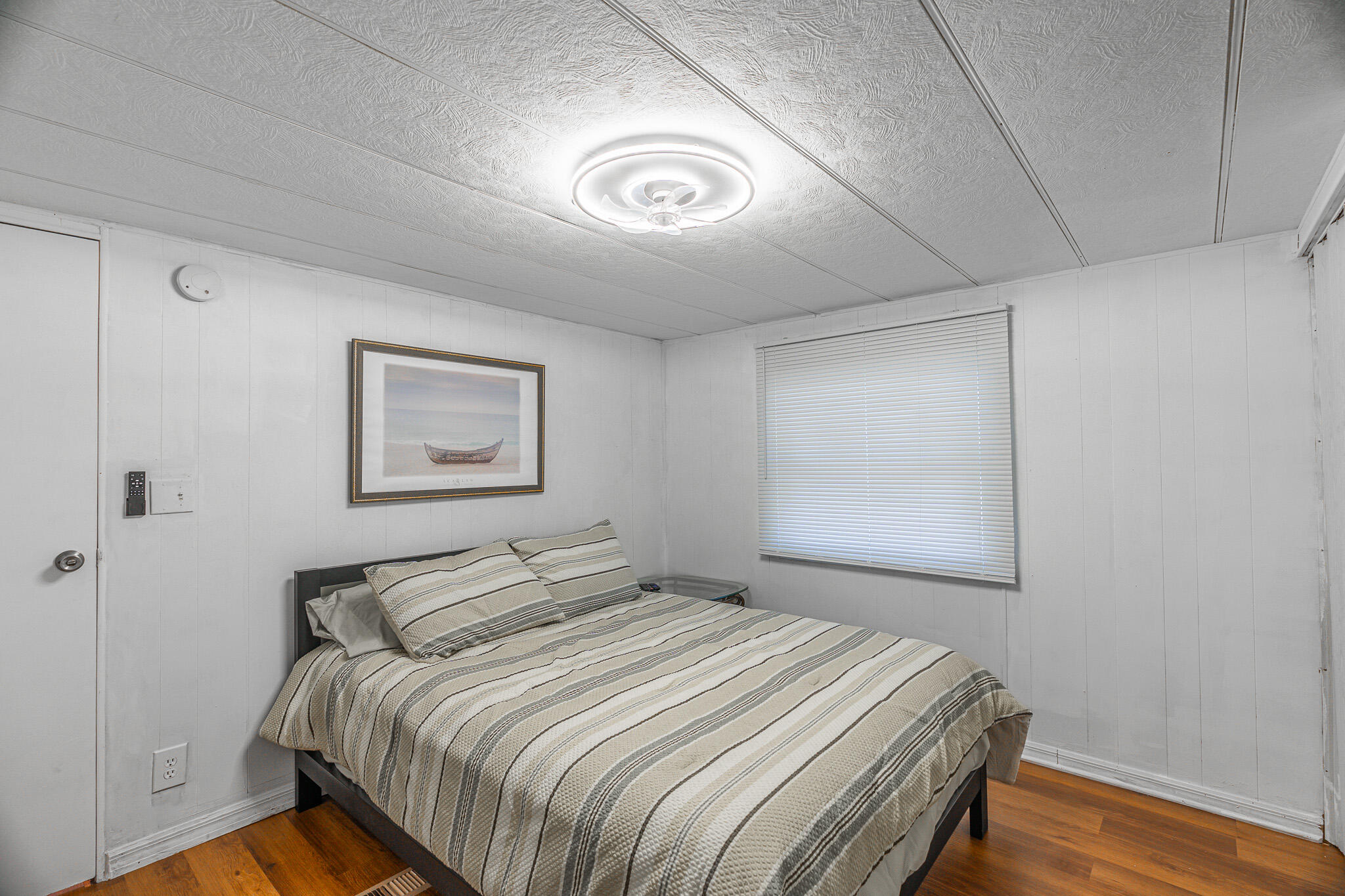 2531 Chatham Way Northeast Palm Bay, FL 32905 - Photo 16 of 28 a bedroom with a bed and a painting on the wall