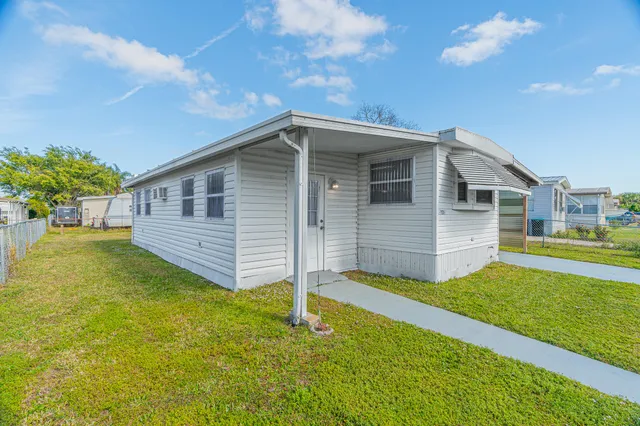 a view of a backyard of the house