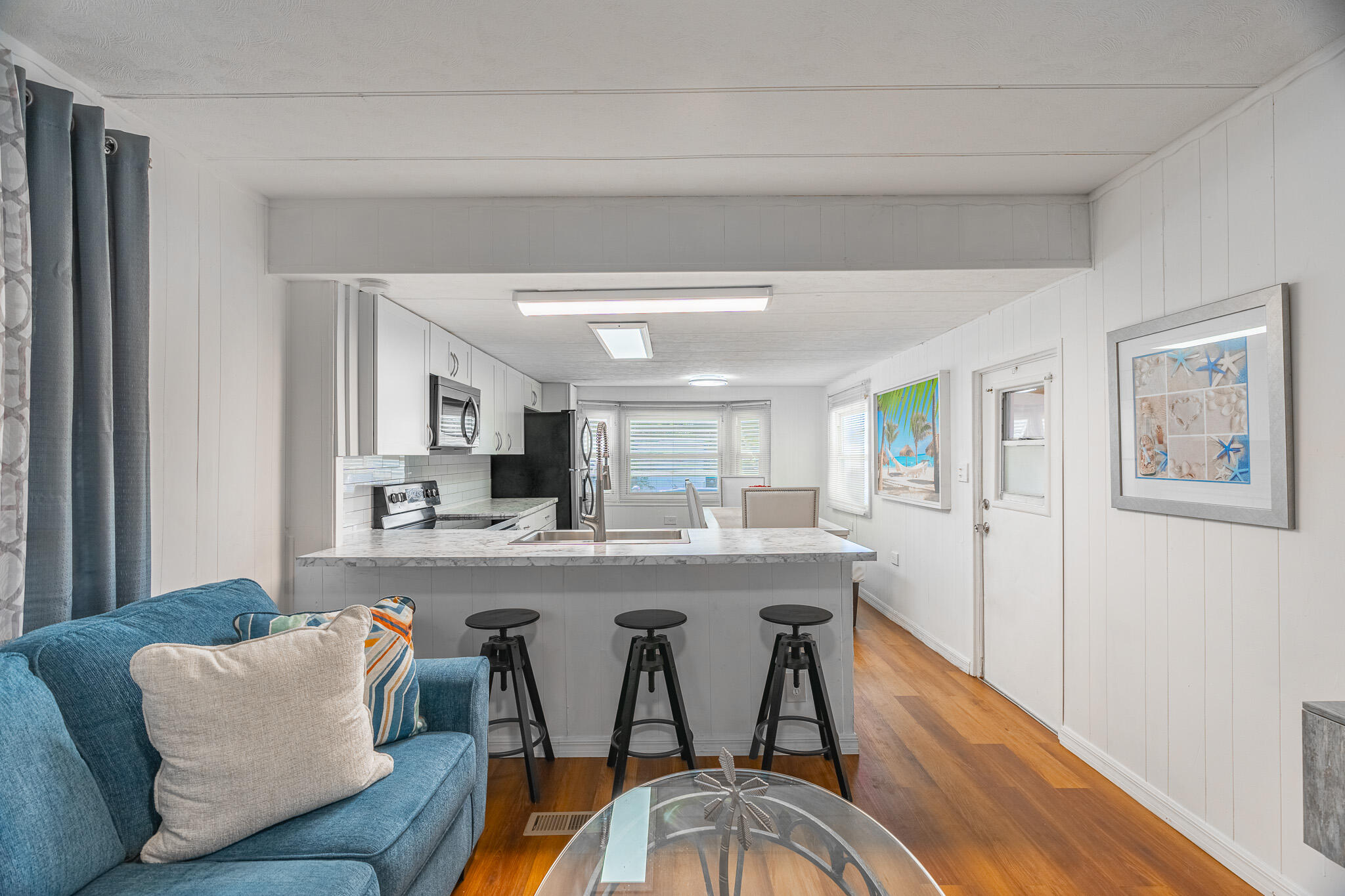 2531 Chatham Way Northeast Palm Bay, FL 32905 - Photo 6 of 28 a view of a dining room with furniture and wooden floor