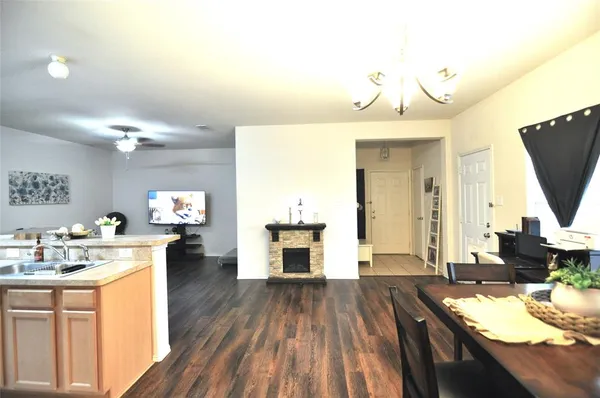 a open kitchen with sink and cabinets