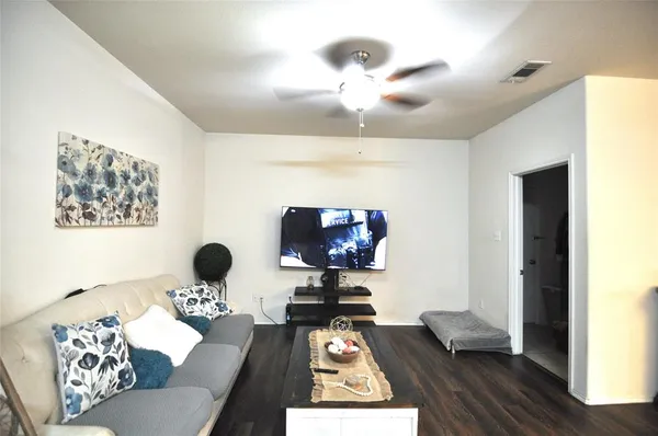 a living room with furniture and a rug