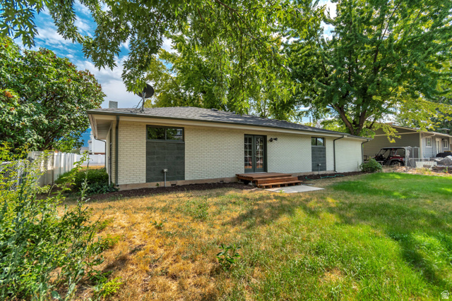 1010 West Maple Street Mapleton, UT 84664 - Photo 22 of 24 Rear exterior with light brick siding and dark trim