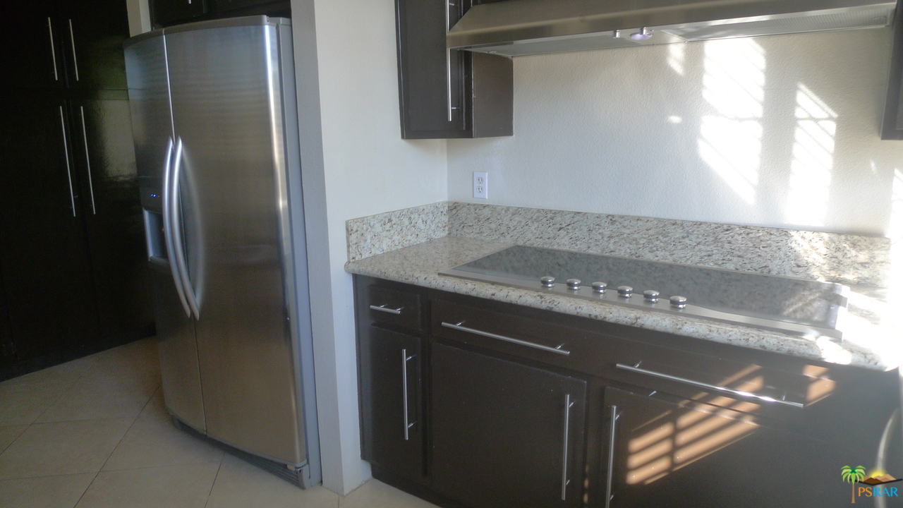 812 Inverness Drive Rancho Mirage, CA 92270 - Photo 11 of 28 a close view of a sink a counter top space and cabinets