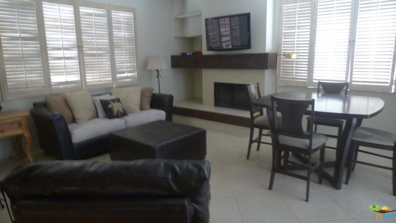 812 Inverness Drive Rancho Mirage, CA 92270 - Photo 12 of 28 a living room with furniture and a fireplace