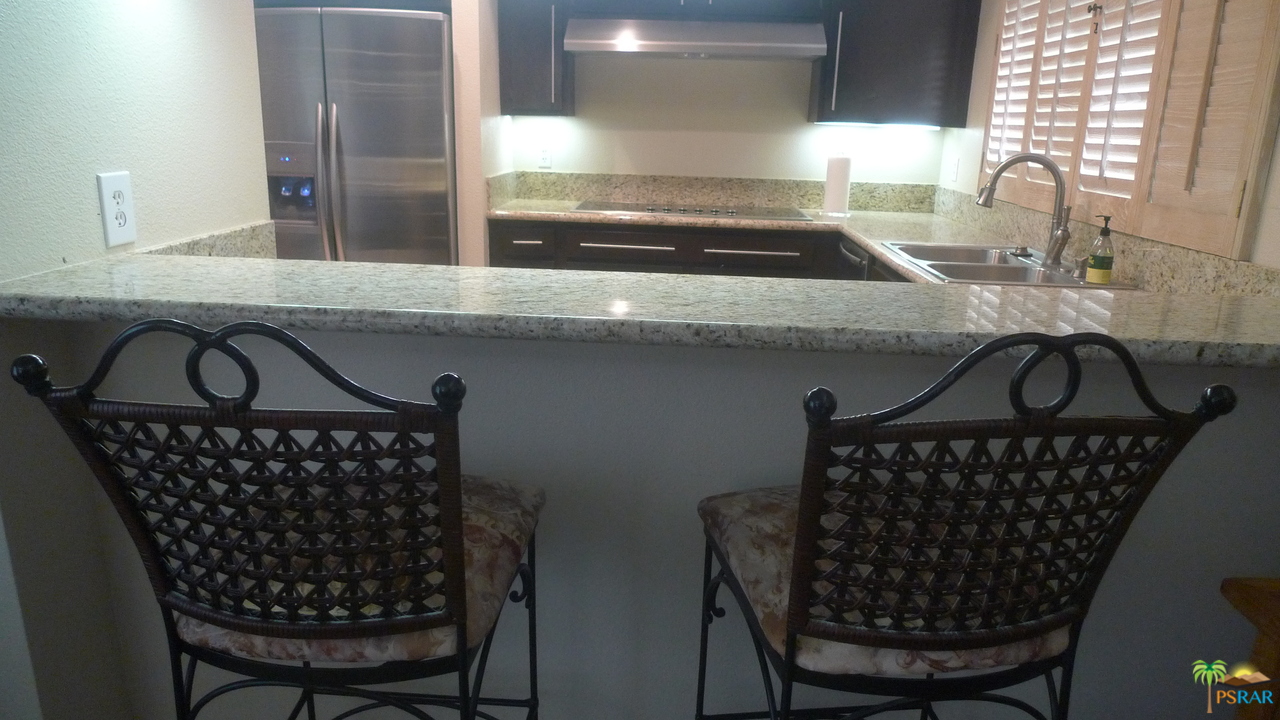 812 Inverness Drive Rancho Mirage, CA 92270 - Photo 13 of 28 a kitchen with a sink a counter and cabinets