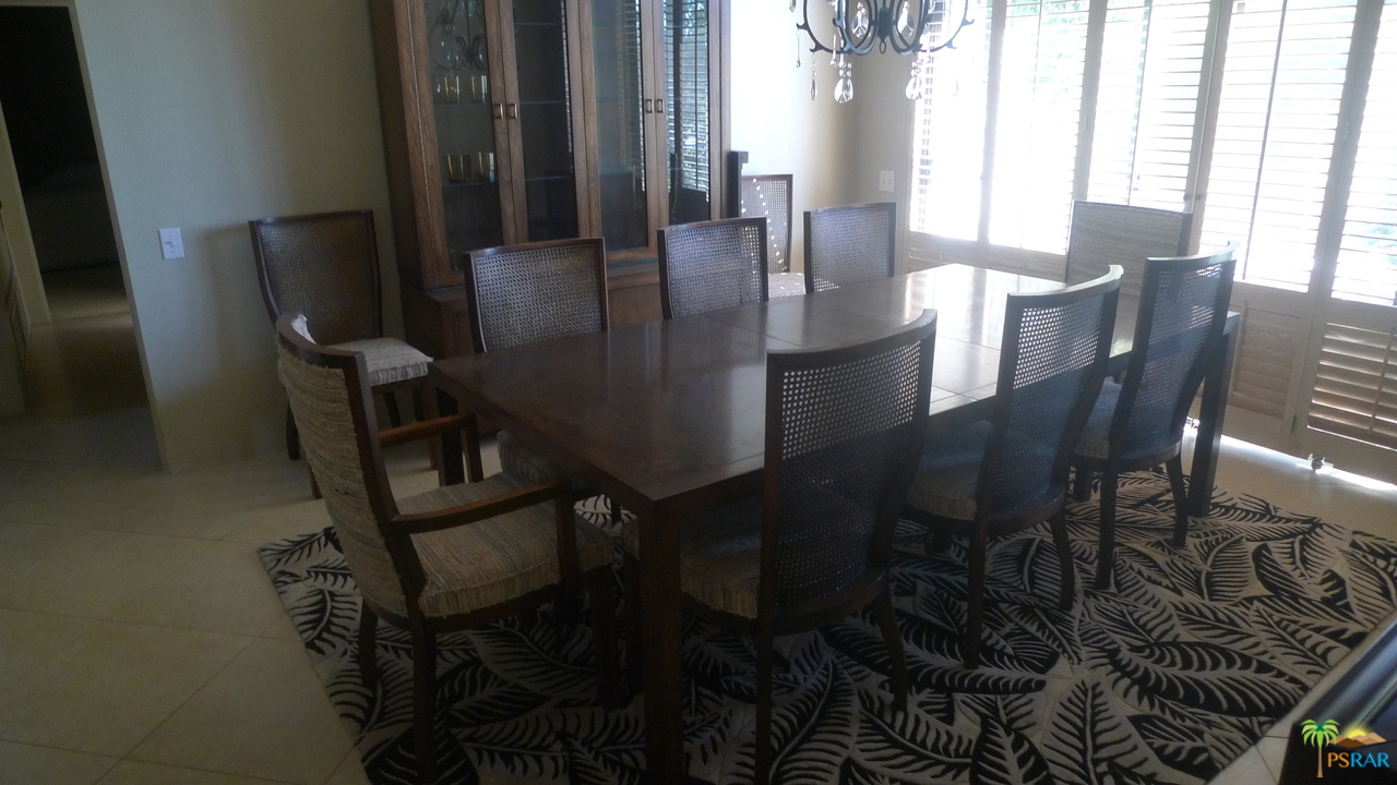 812 Inverness Drive Rancho Mirage, CA 92270 - Photo 16 of 28 a view of a dining room with furniture and window