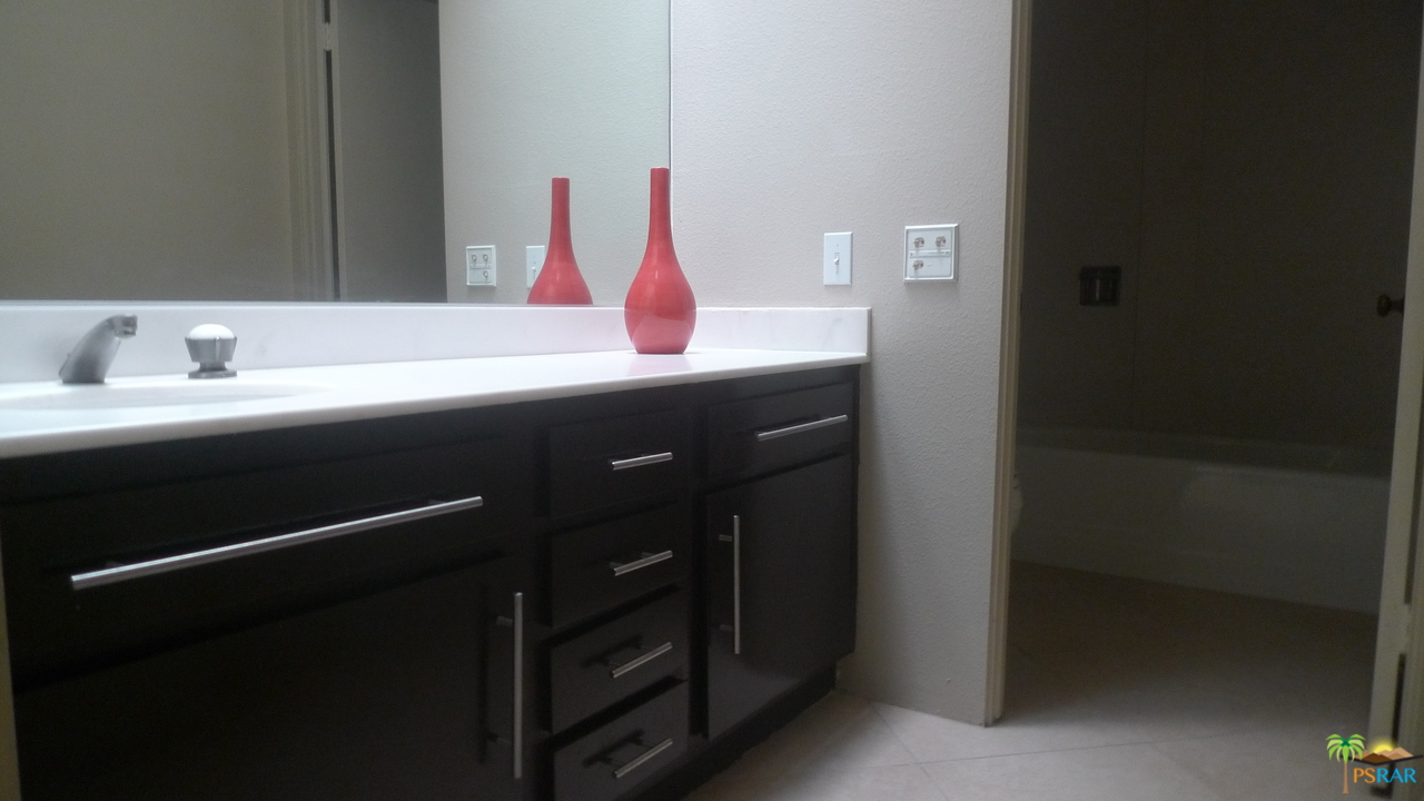 812 Inverness Drive Rancho Mirage, CA 92270 - Photo 21 of 28 a bathroom with a sink and a mirror