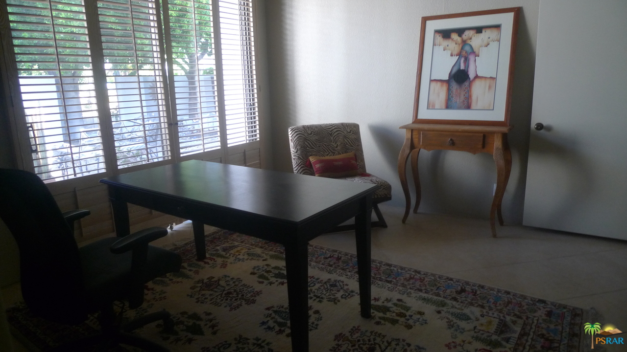 812 Inverness Drive Rancho Mirage, CA 92270 - Photo 24 of 28 a view of a workspace with furniture and a window