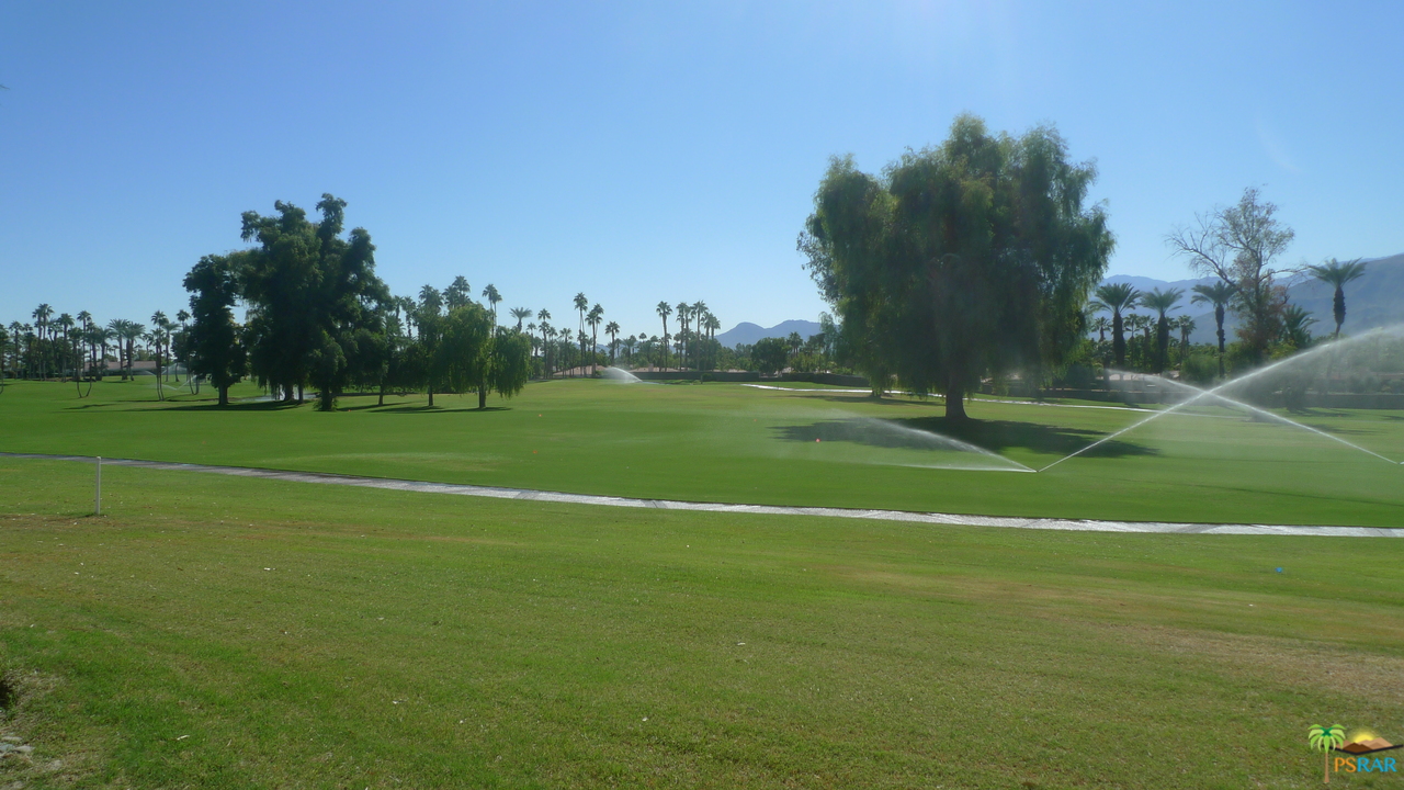 812 Inverness Drive Rancho Mirage, CA 92270 - Photo 27 of 28 a view of a tennis ground with a large trees