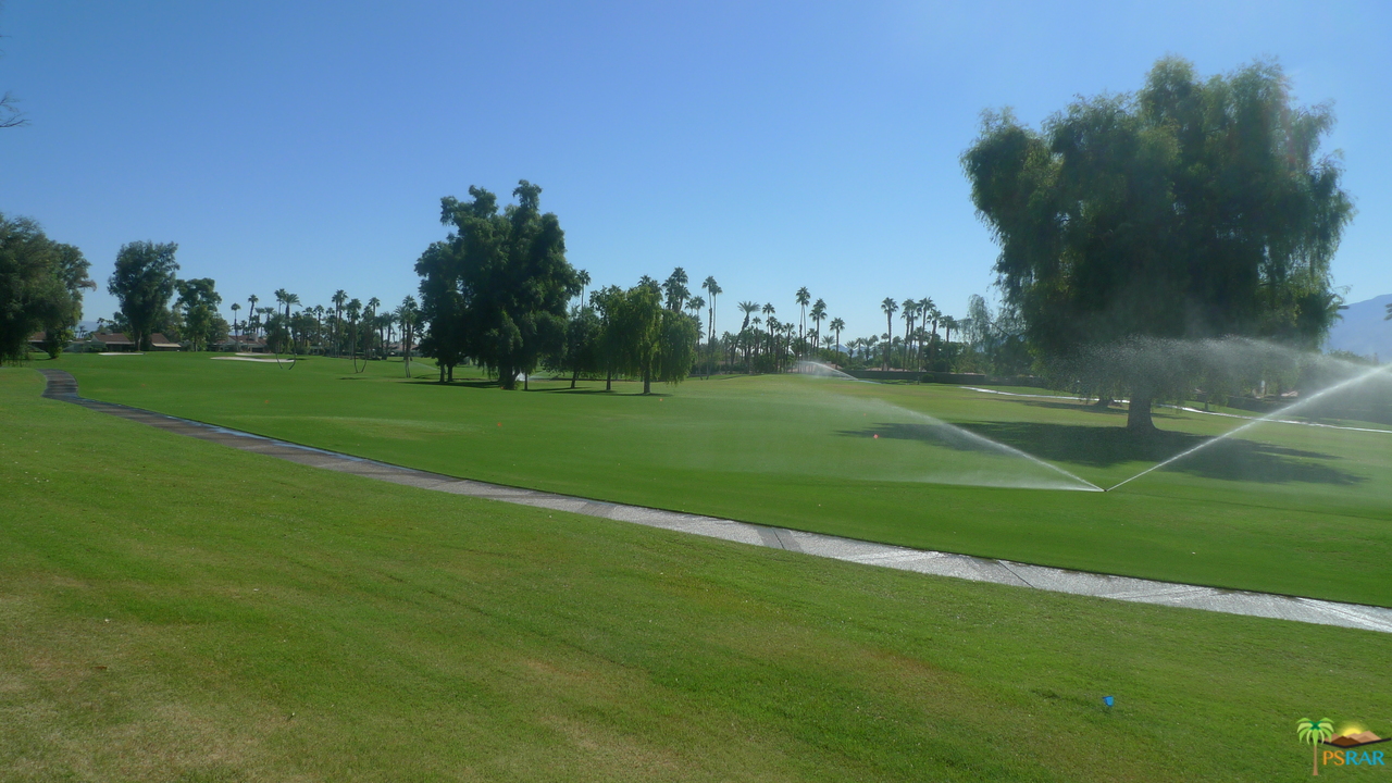 812 Inverness Drive Rancho Mirage, CA 92270 - Photo 28 of 28 a view of a golf course with a lake