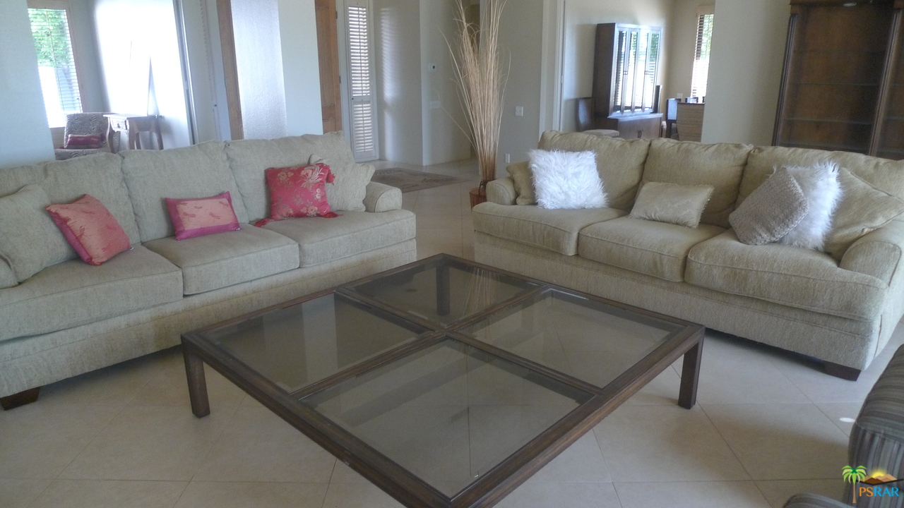 812 Inverness Drive Rancho Mirage, CA 92270 - Photo 6 of 28 a living room with furniture and a potted plant