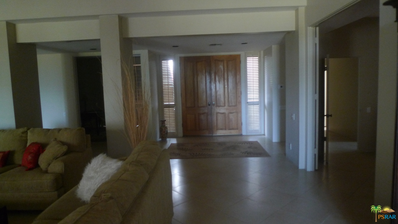 812 Inverness Drive Rancho Mirage, CA 92270 - Photo 8 of 28 a view of a hallway with couches and potted plant