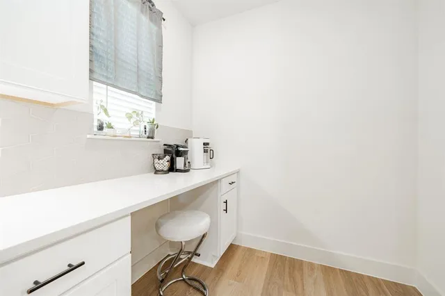 a room with a sink and a mirror