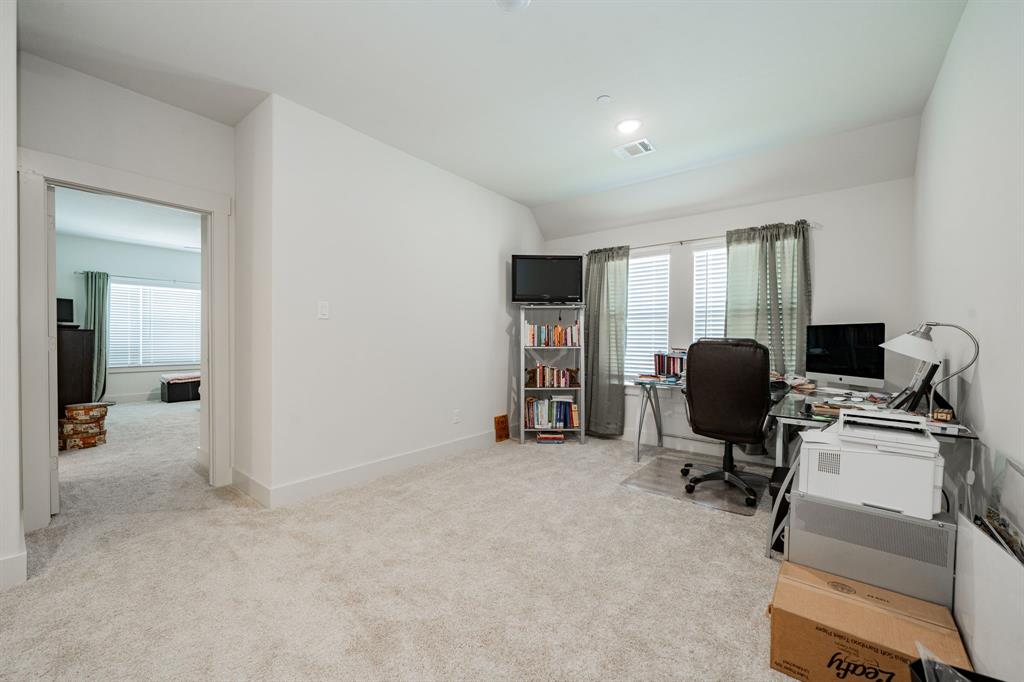 1416 Solterra Boulevard Mesquite, TX 75181 - Photo 25 of 32 a view of a livingroom with workspace and a window