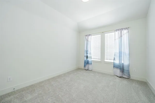 an empty room with a empty space and a window