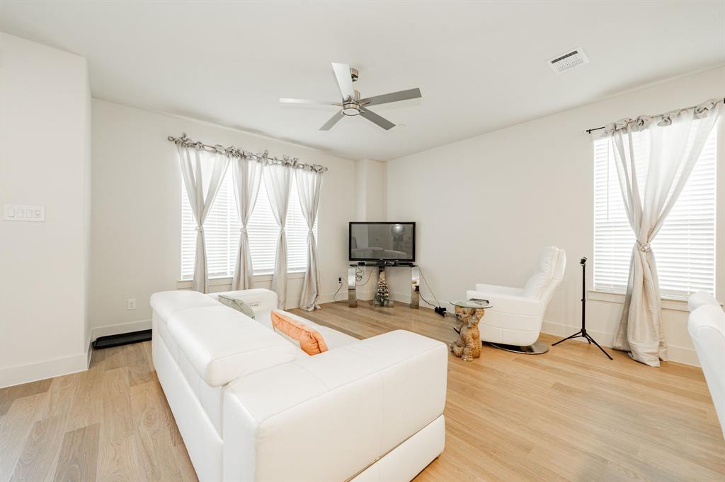 1416 Solterra Boulevard Mesquite, TX 75181 - Photo 6 of 32 a living room with furniture and a flat screen tv