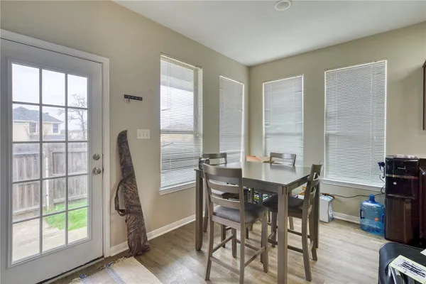 a view of a dining room with furniture window and outside view