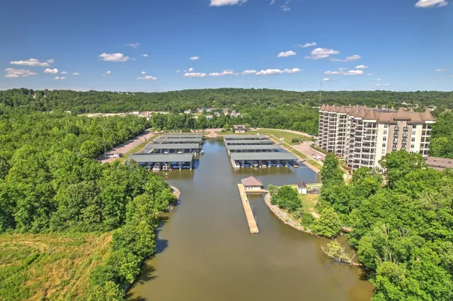 a large kitchen with kitchen island a sink stainless steel appliances and cabinets