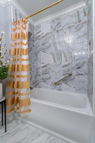 a living room with furniture and a dining table with kitchen view