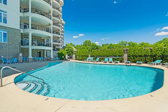 a view of a dining room with furniture and front door