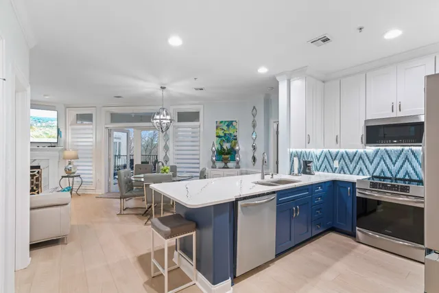 a dining room with furniture a window and a chandelier