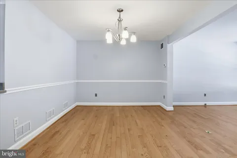 a metallic refrigerator freezer sitting in a kitchen