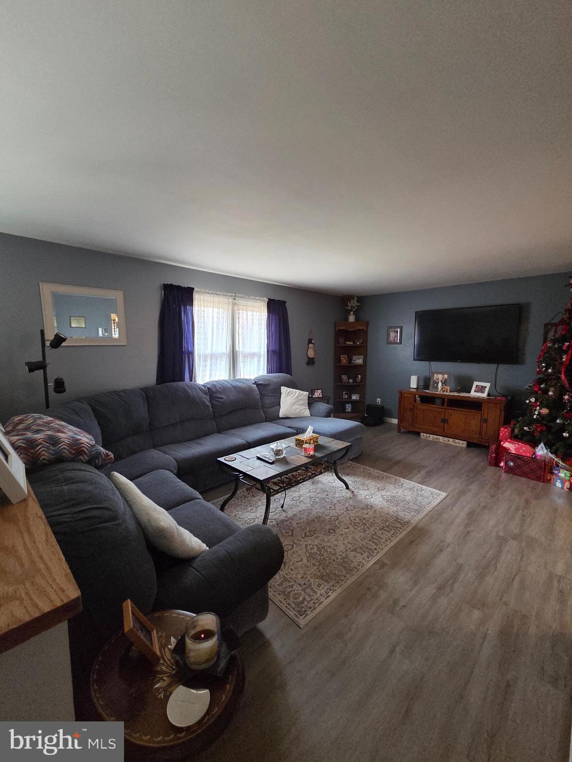 64 Rosedale Drive Bridgeton, NJ 08302 - Photo 3 of 16 a living room with furniture and a car parked
