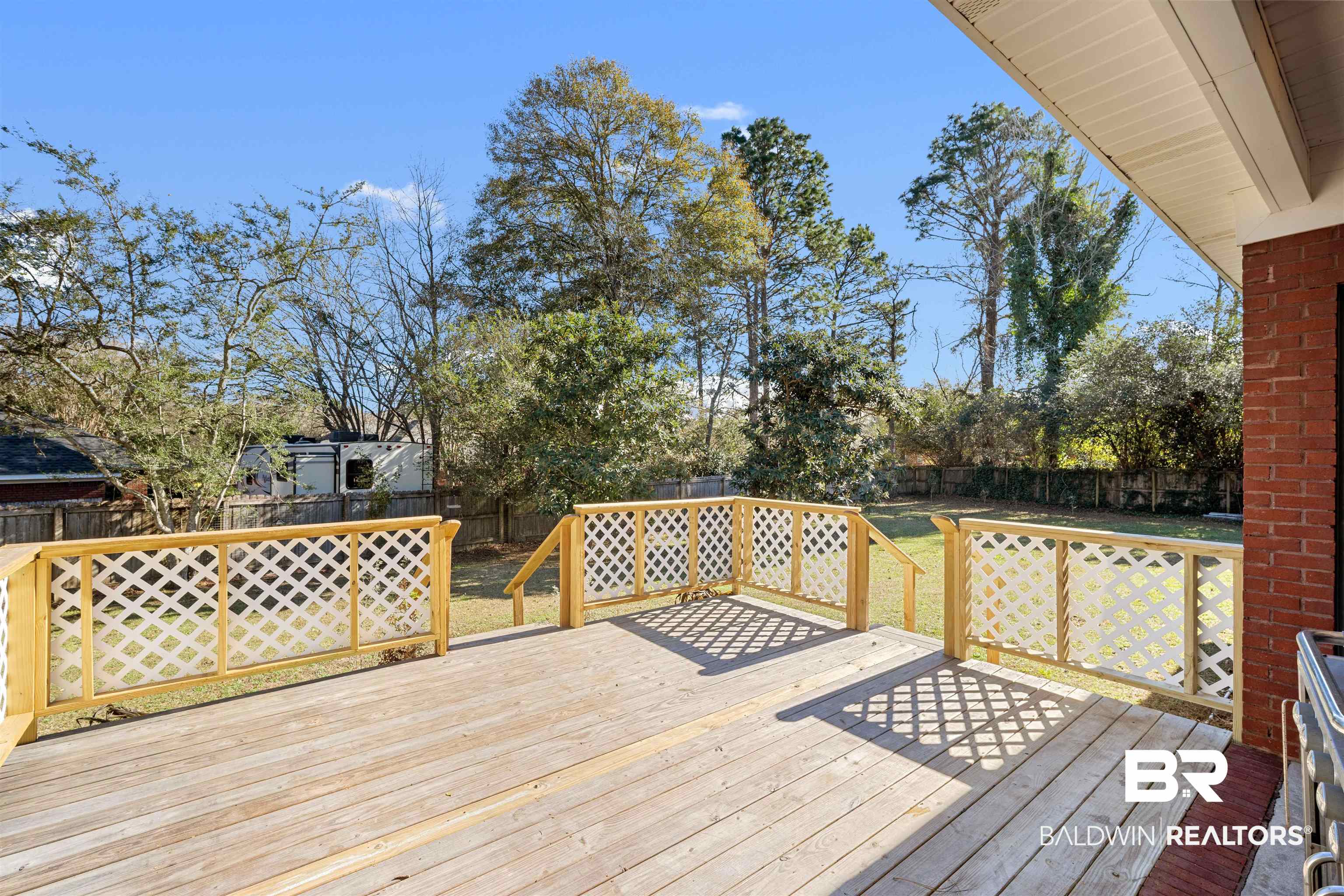 615 Summerlake Place Mobile, AL 36608 - Photo 32 of 35 Wooden terrace with a fenced backyard
