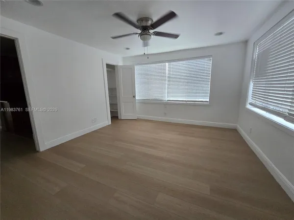 a view of an empty room with a window