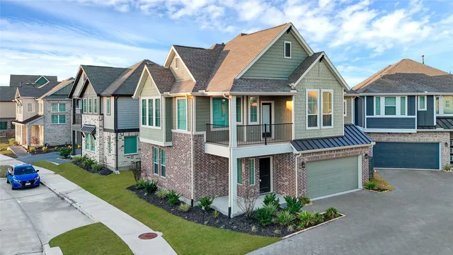 an aerial view of a house with a swimming pool