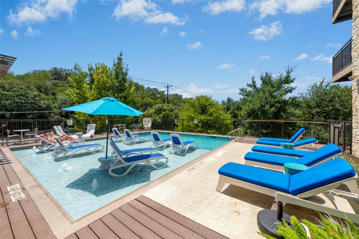 a view of swimming pool with lounge chair