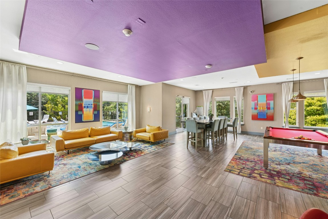 1900 Barton Springs Road, Unit 4004 Austin, TX 78704 - Photo 2 of 19 a living room filled with furniture wooden floor and a table