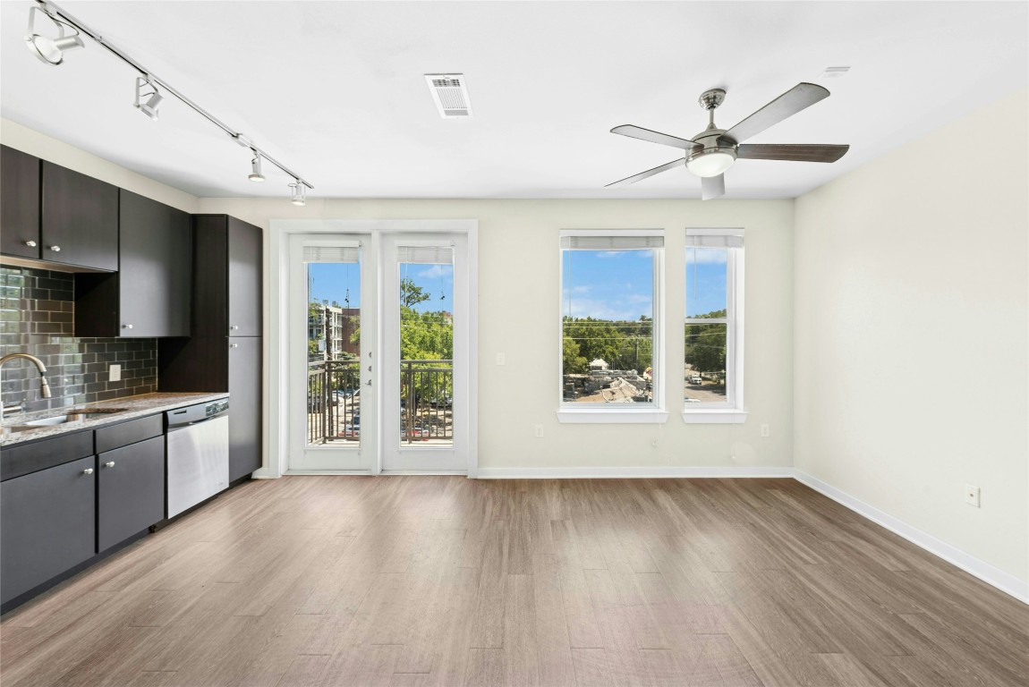 1900 Barton Springs Road, Unit 4004 Austin, TX 78704 - Photo 5 of 19 a view of a kitchen with wooden floor and a window